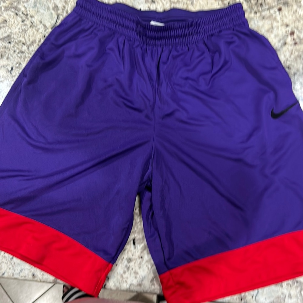 Nike purple and red gym shorts.